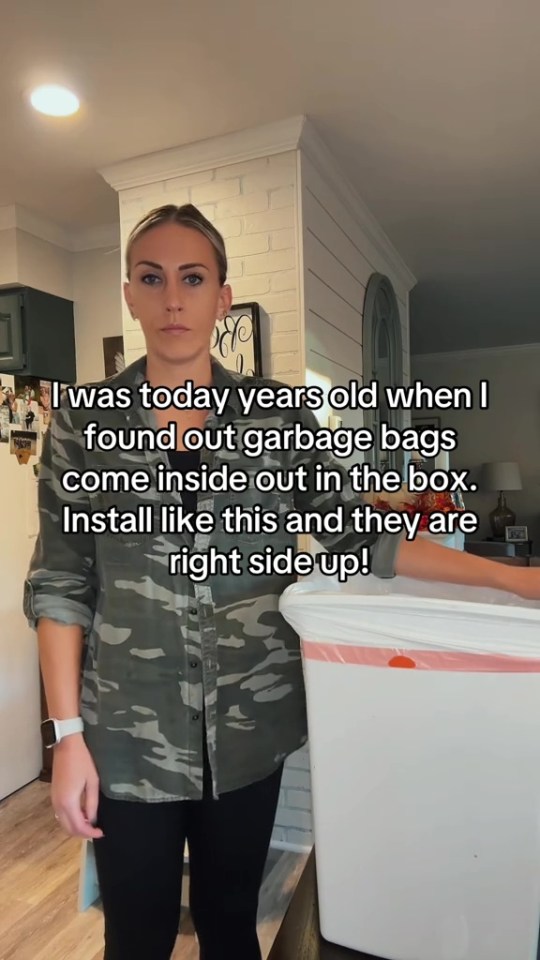 a woman in a camo shirt is standing in front of a trash can and says i was today years old