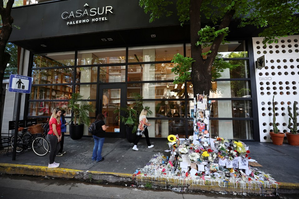 people standing outside of casasur palermo hotel