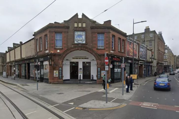 the front of a building that says the front of the wall