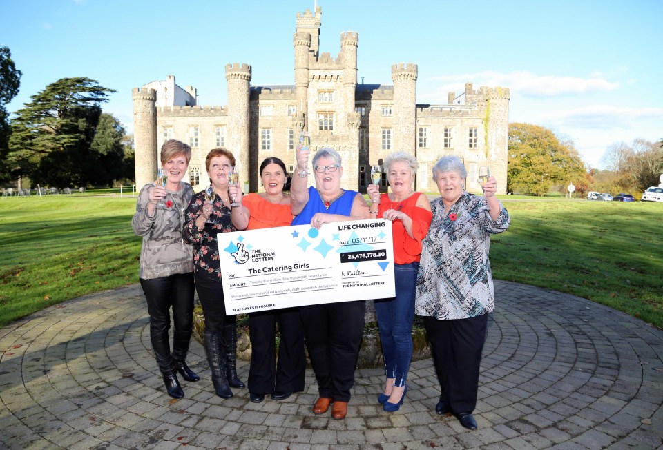 a group of women holding a cheque that says life changing