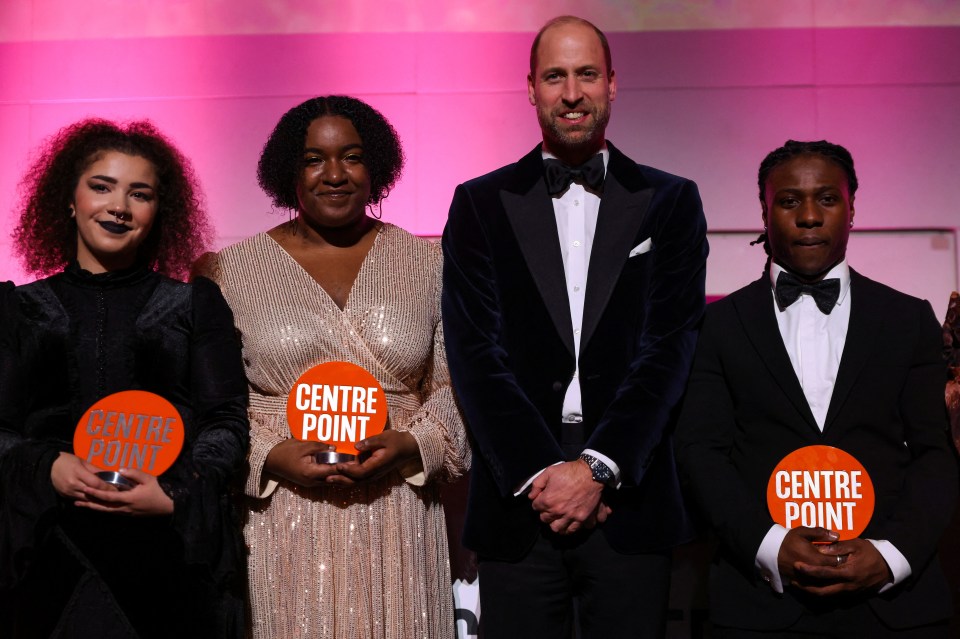 a group of people holding plaques that say centre point