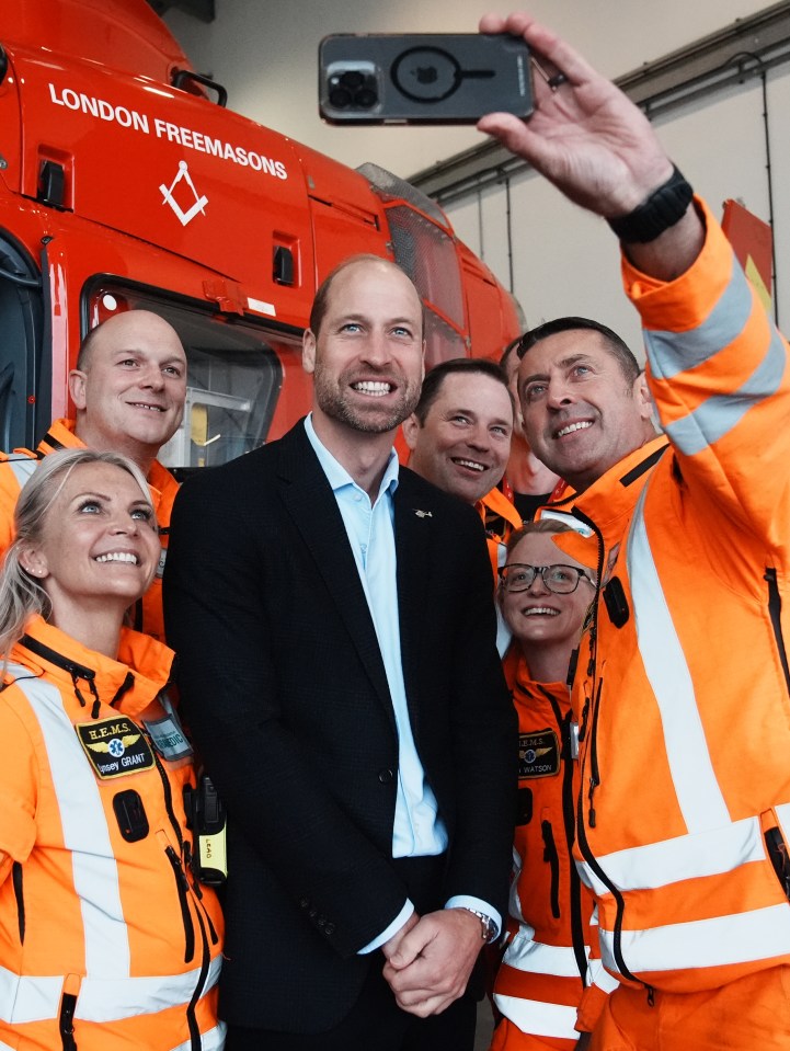 The Prince of Wales had time to pose for a selfie with staff