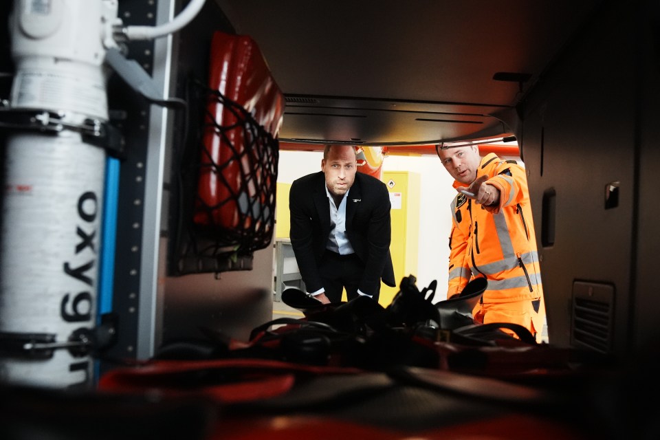 two men are looking at a container that says oxygen on it