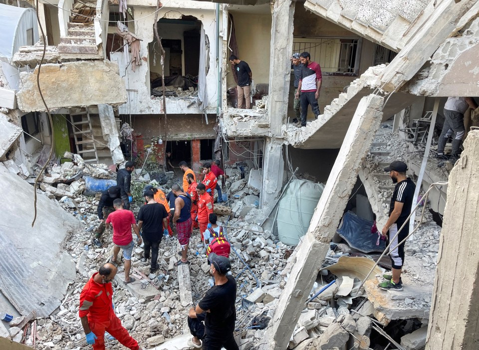 Rescuers searching through the rubble near the southern city of Sidon