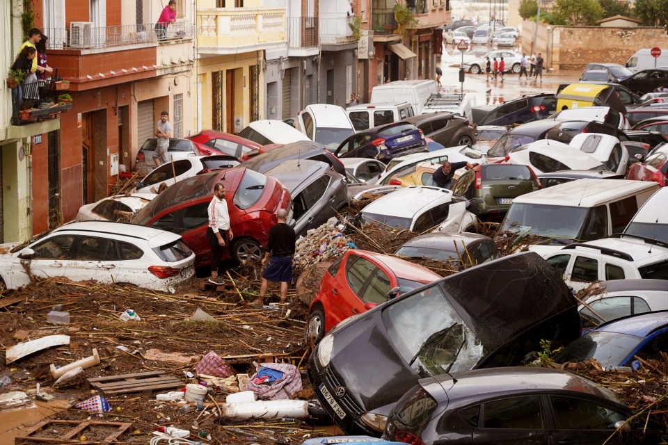 a bunch of cars are stacked on top of each other including a toyota