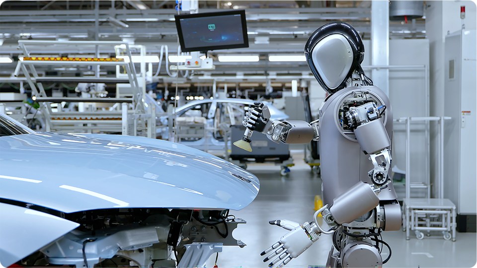 a robot is working on a car in a factory