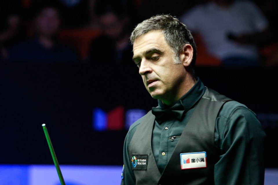 a snooker player with a name tag that says northern ireland