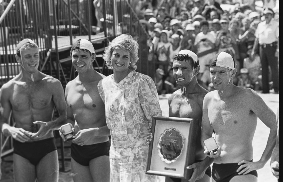 1988: The Princess chats with lifeguards at a surf event