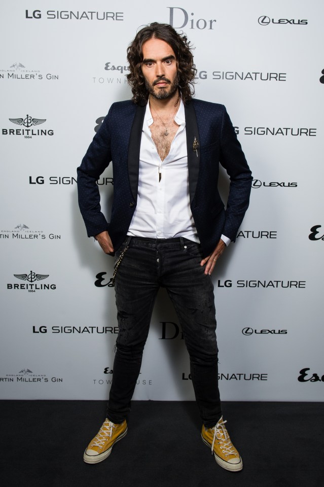 a man standing in front of a wall that says lg signature