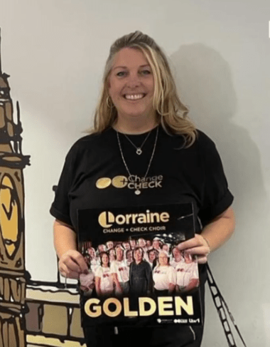 a woman is holding a book titled golden