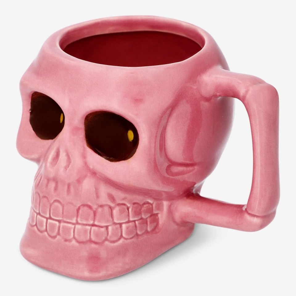 a pink mug in the shape of a skull