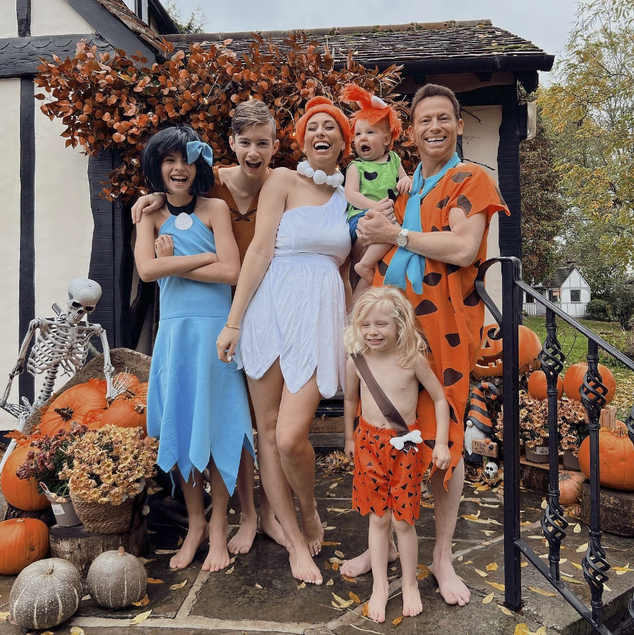 Stacey, husband Joe, and the kids dressed up as The Flintstones for Halloween