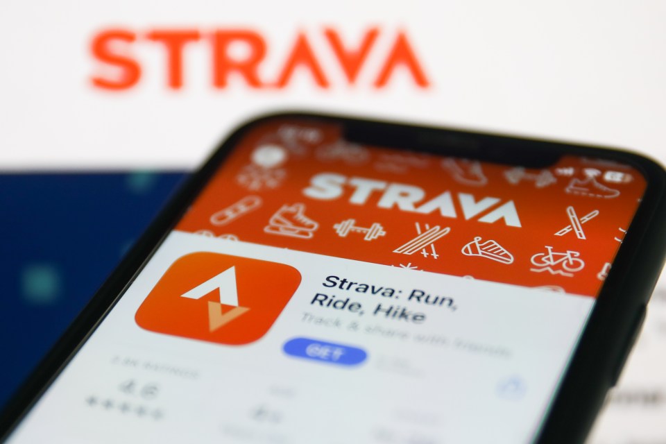 a phone with the strava app open on the screen