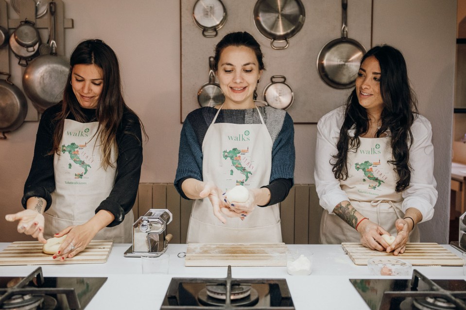 three women wear aprons that say walks on them