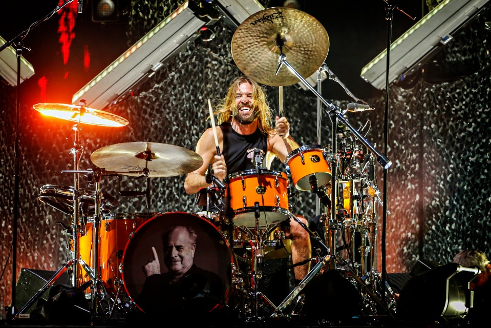 a man playing drums with a cymbal that says sabian on it