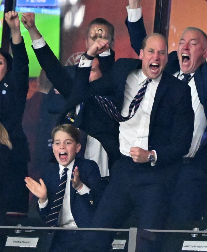 a group of men in suits and ties are cheering in a stadium