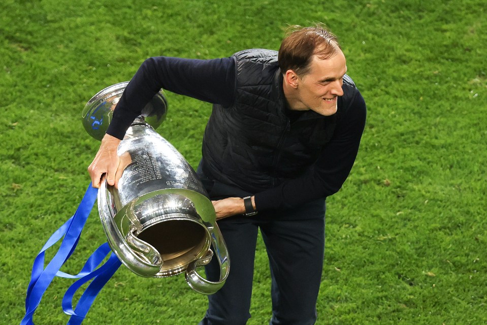 a man holding a trophy with the word champions on it