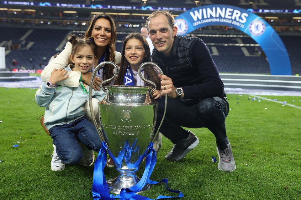 a family posing with a trophy that says winners on it