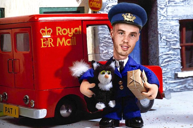 a postman holding a stuffed animal in front of a royal mail truck