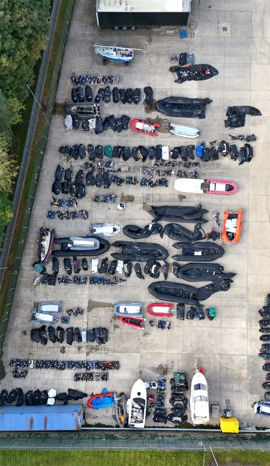 a bunch of boats are lined up in a parking lot