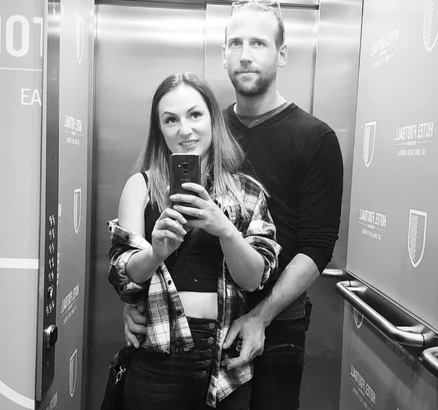 a man and a woman are taking a selfie in an elevator with a sign that says limited edition