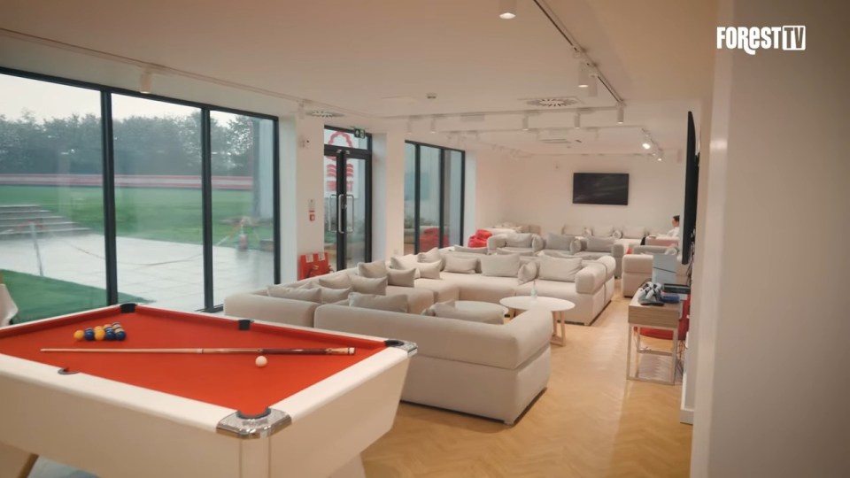 The epic games room includes sofas and pool tables