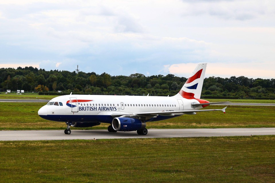 a british airways plane is sitting on the runway