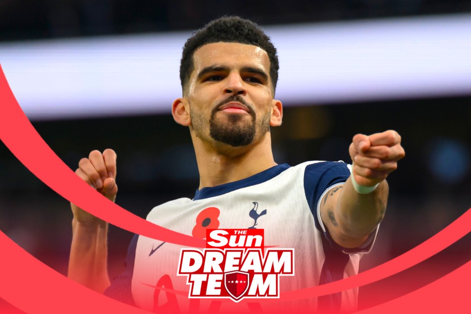 a soccer player is pointing at the sun dream team