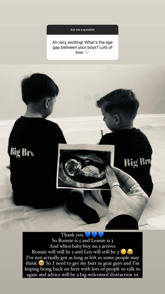 two boys wearing big bro shirts sit next to each other