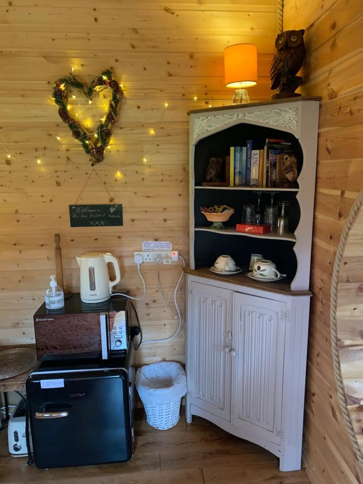 a corner of a room with a sign that says welcome to the happy home