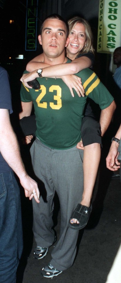 Robbie Williams and Nicole Appleton leave a London club in 1998