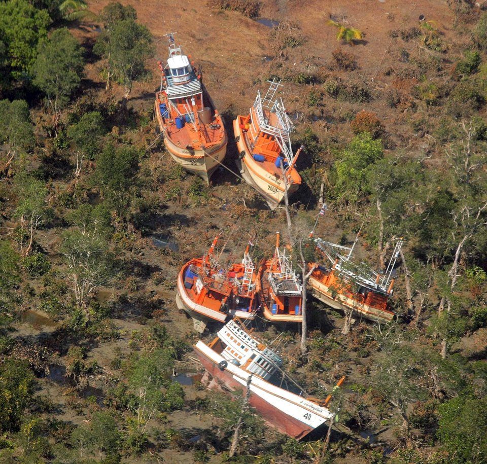 Washed up boats are pictured 72 miles north of the Thai island of Phuket