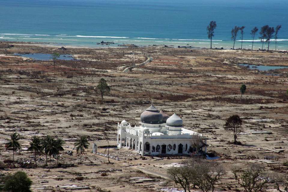 An aerial photo taken on the Indonesian island of Sumatra highlights the ease with with the wave destroyed entire towns, many of which were build from wood