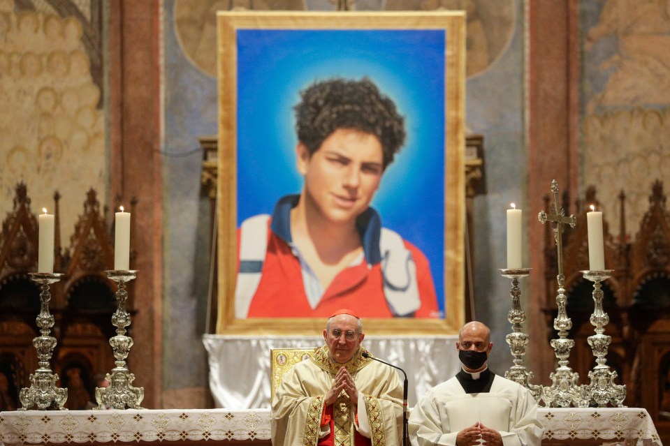 Carlo was beatified, above, the first step towards sainthood, in 2020