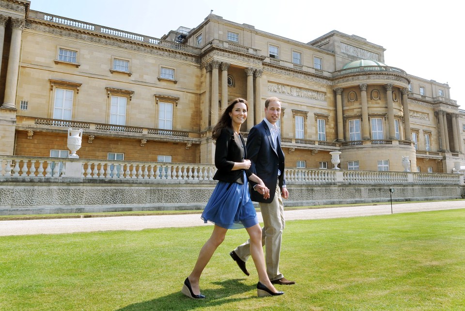 Prince William and Kate Middleton walk hand in hand from Buckingham Palace in London the day after their wedding