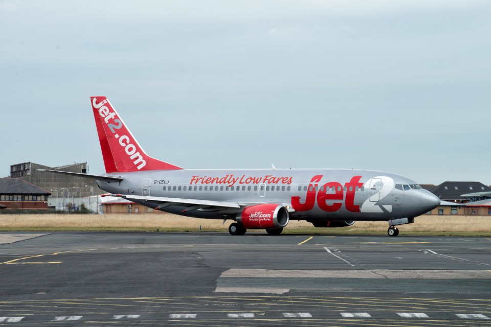 a jet2 plane is parked on the runway