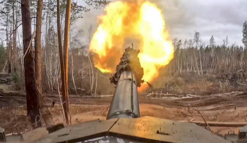 A still image shows a Russian T90M tank firing towards Ukrainian positions, at an undisclosed location in Russia