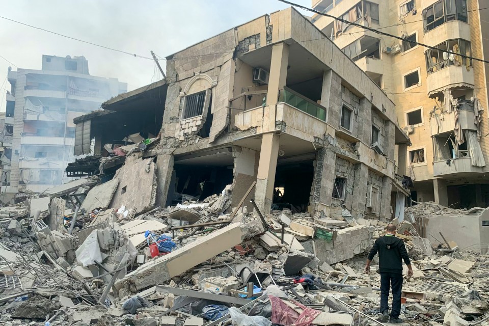 A man inspects the damage at the site of overnight Israeli airstrikes that targeted the Laylaki neighbourhood in Beirut’s southern suburbs on November 9