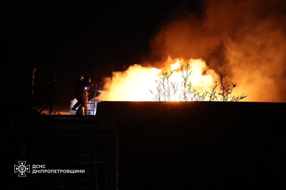 Firefighters work at the site of a Russian missile strike in Dnipro, Ukraine, on Thursday