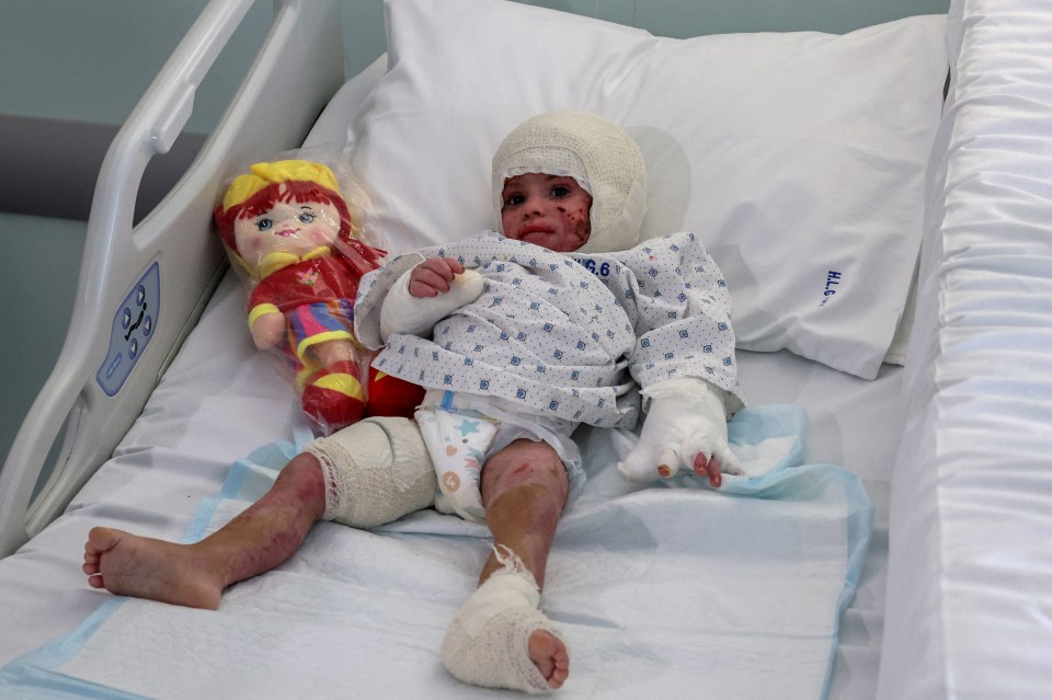 a child in a hospital bed with the number 4.6 on the pillow