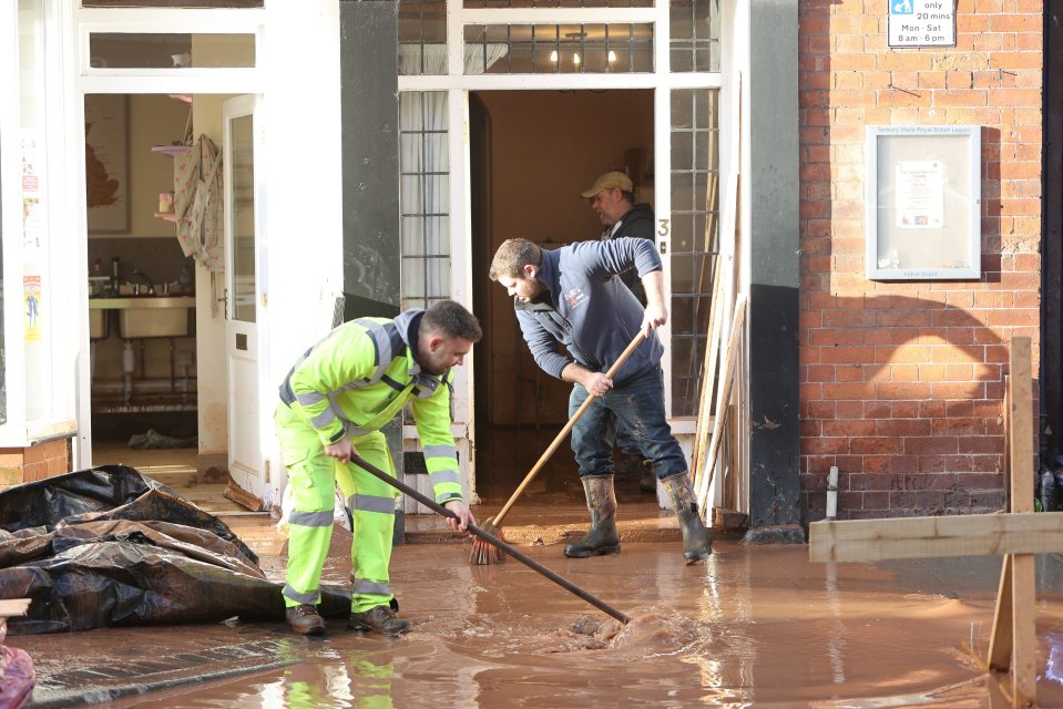 People cleaning up after the flooding in Tenbury Wells