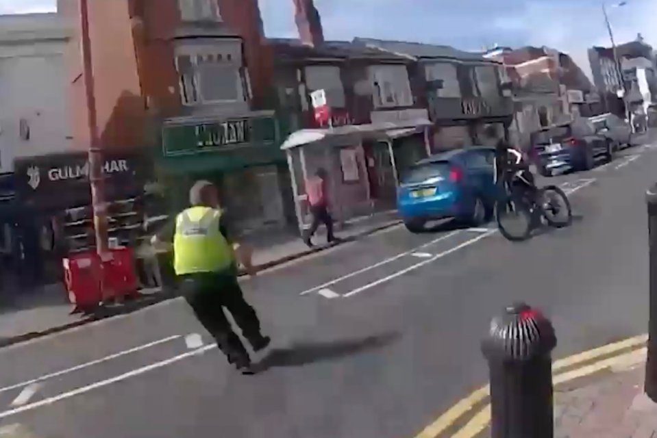 PC Matthew More can be seen running to intercept the cyclist