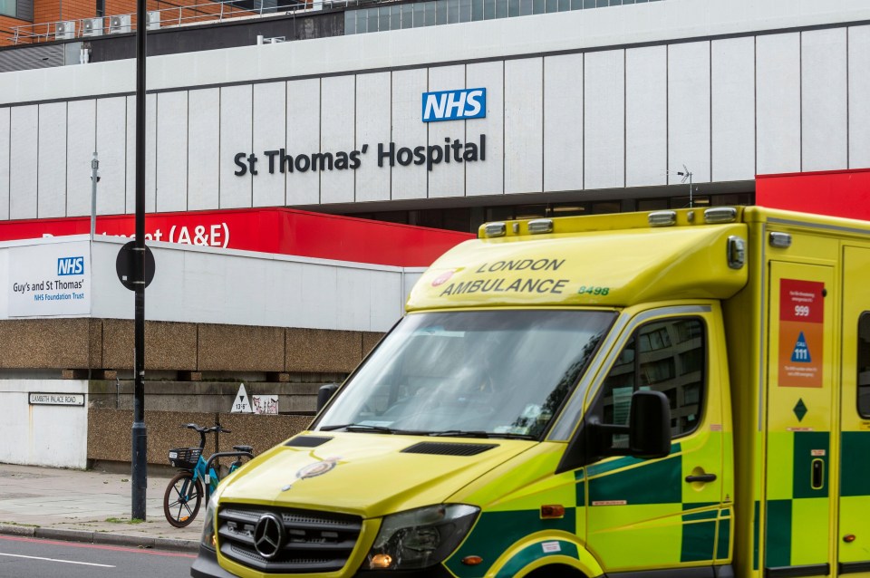 an ambulance is parked in front of the st thomas hospital