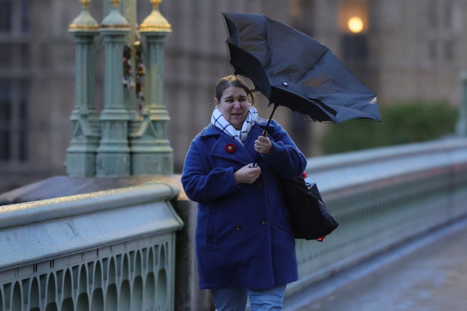 Wet and windy conditions on Westminster Bridge in central London