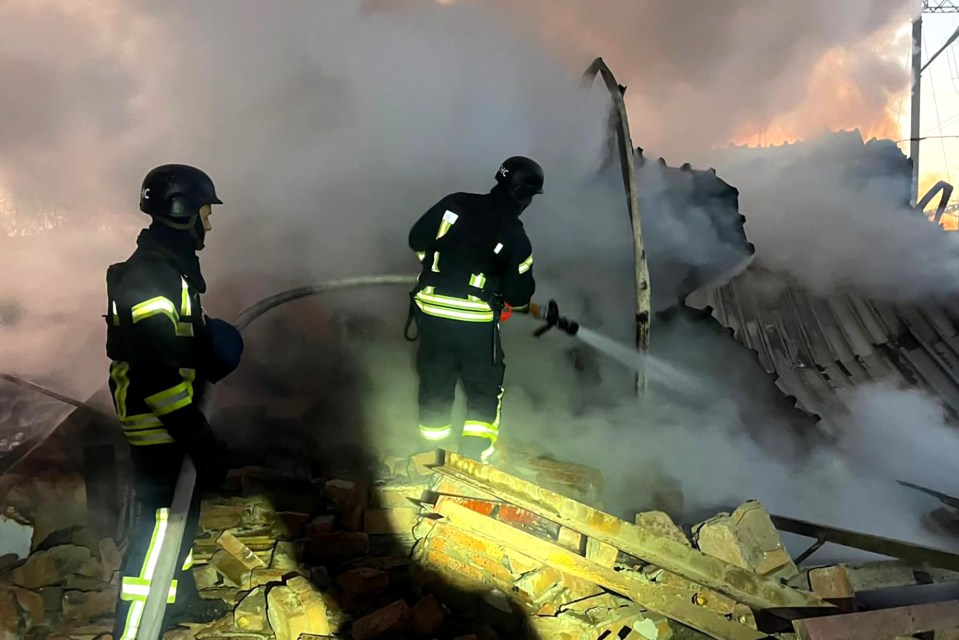 Ukrainian rescuers workers after a Russian missile attack in Lutsk, Ukraine