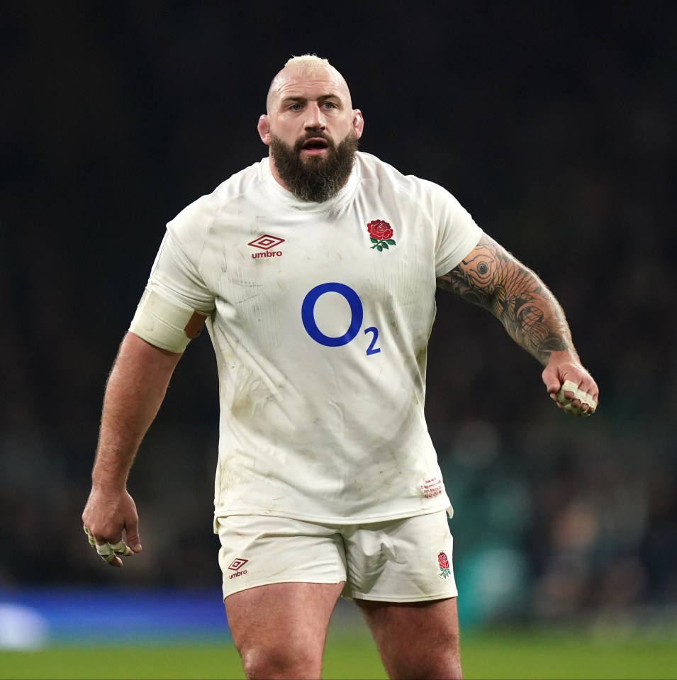 a man in a white o2 jersey stands on a field