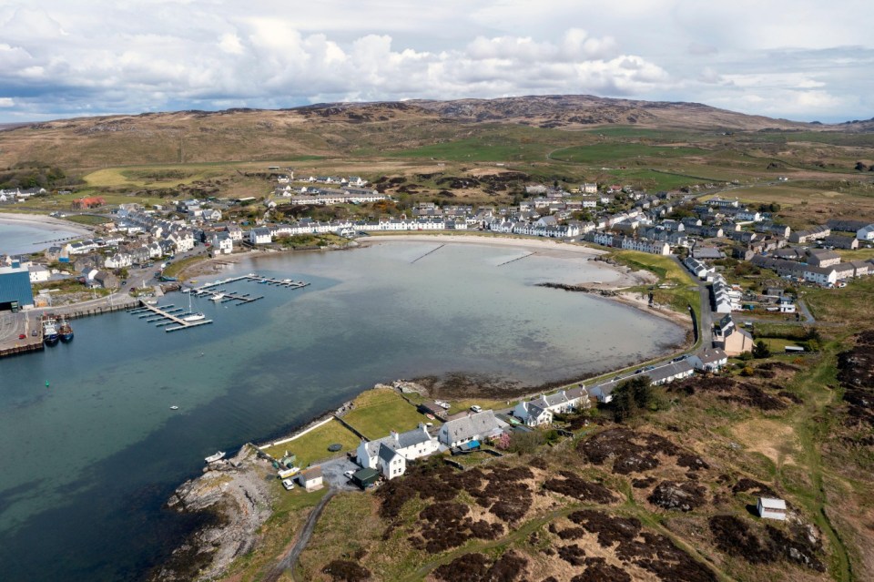 2FNMHT5 Aerial view of houses overlooking Leodamais Bay in Islay village of Port Ellen, Isle of Islay, Inner Hebrides, Scotland UK