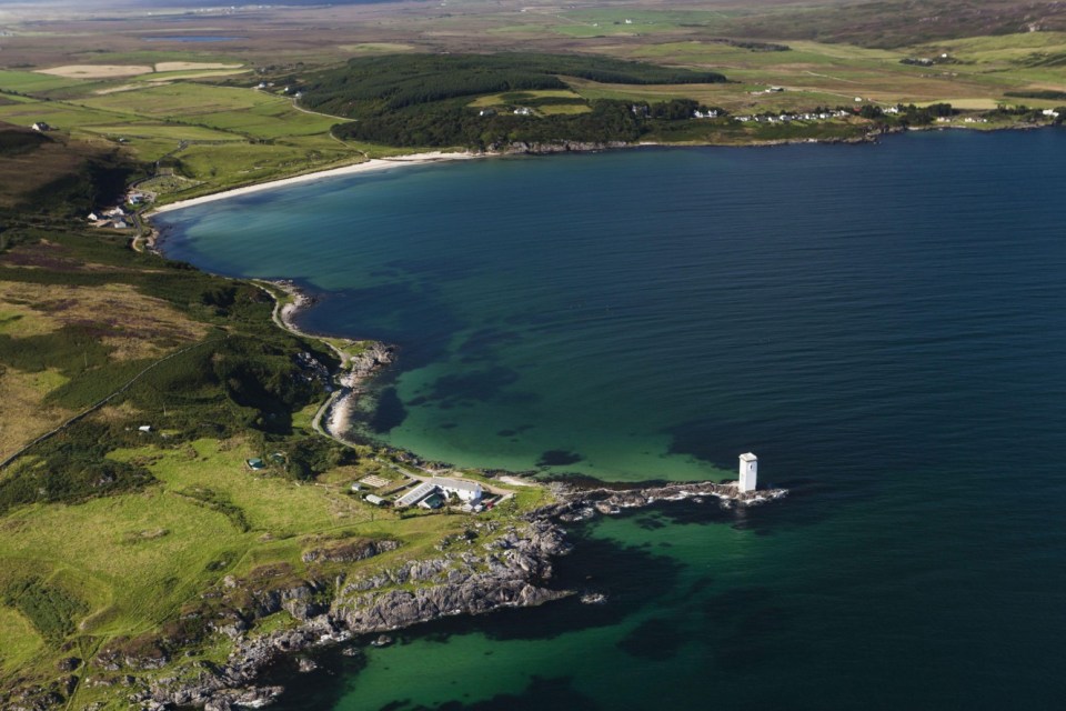 2P4G3N4 Aerial view of coastline and lighthouse, Carraig Fhada Lighthouse, Port Ellen, Isle of Islay, Inner Hebrides, Scotland, United Kingdom