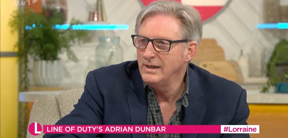 a man with glasses is on a tv show called line of duty 's adrian dunbar