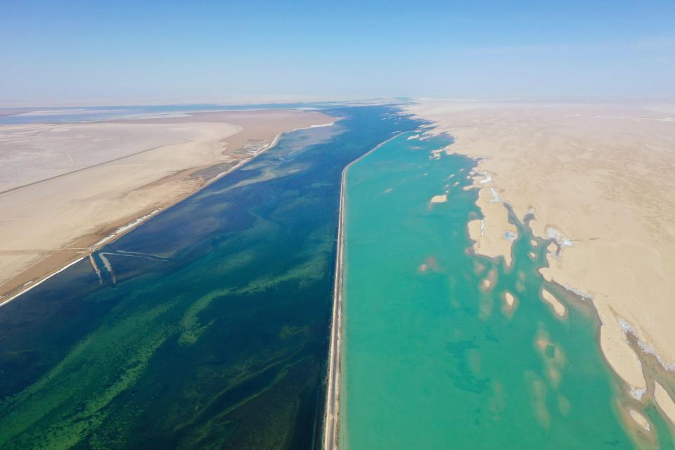 The Qaidam Basin and the Quaidam River that runs through it are icy blue and contain salt